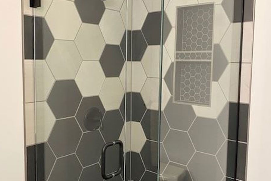 There is a wooden bench in the shower.