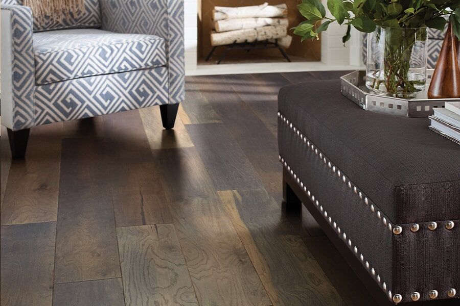 A staircase with a black railing and white steps in a house.