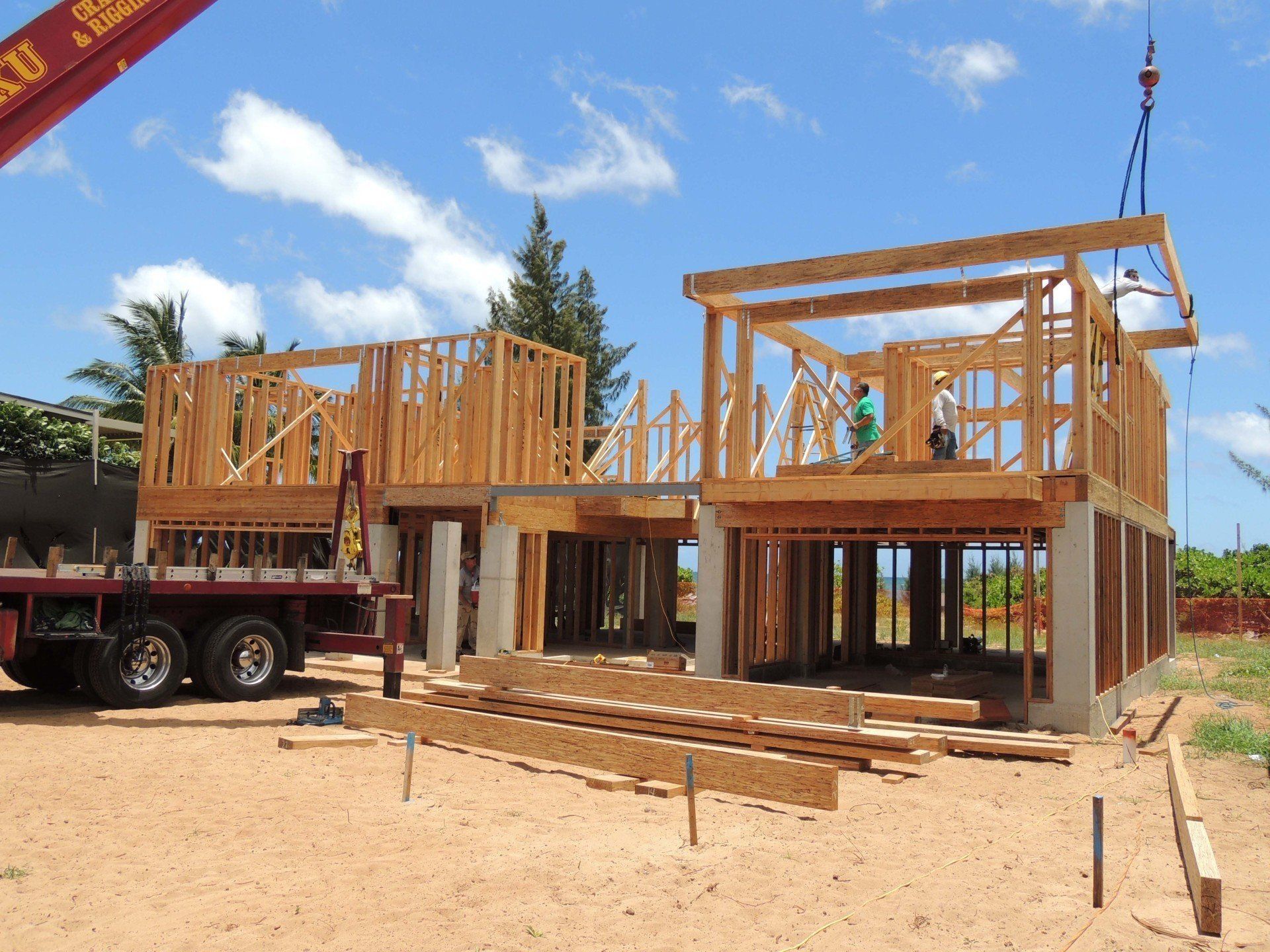 A house is being built with a crane in the background