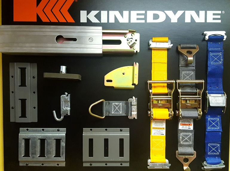 A bunch of different types of tie downs are on display for kinedyne
