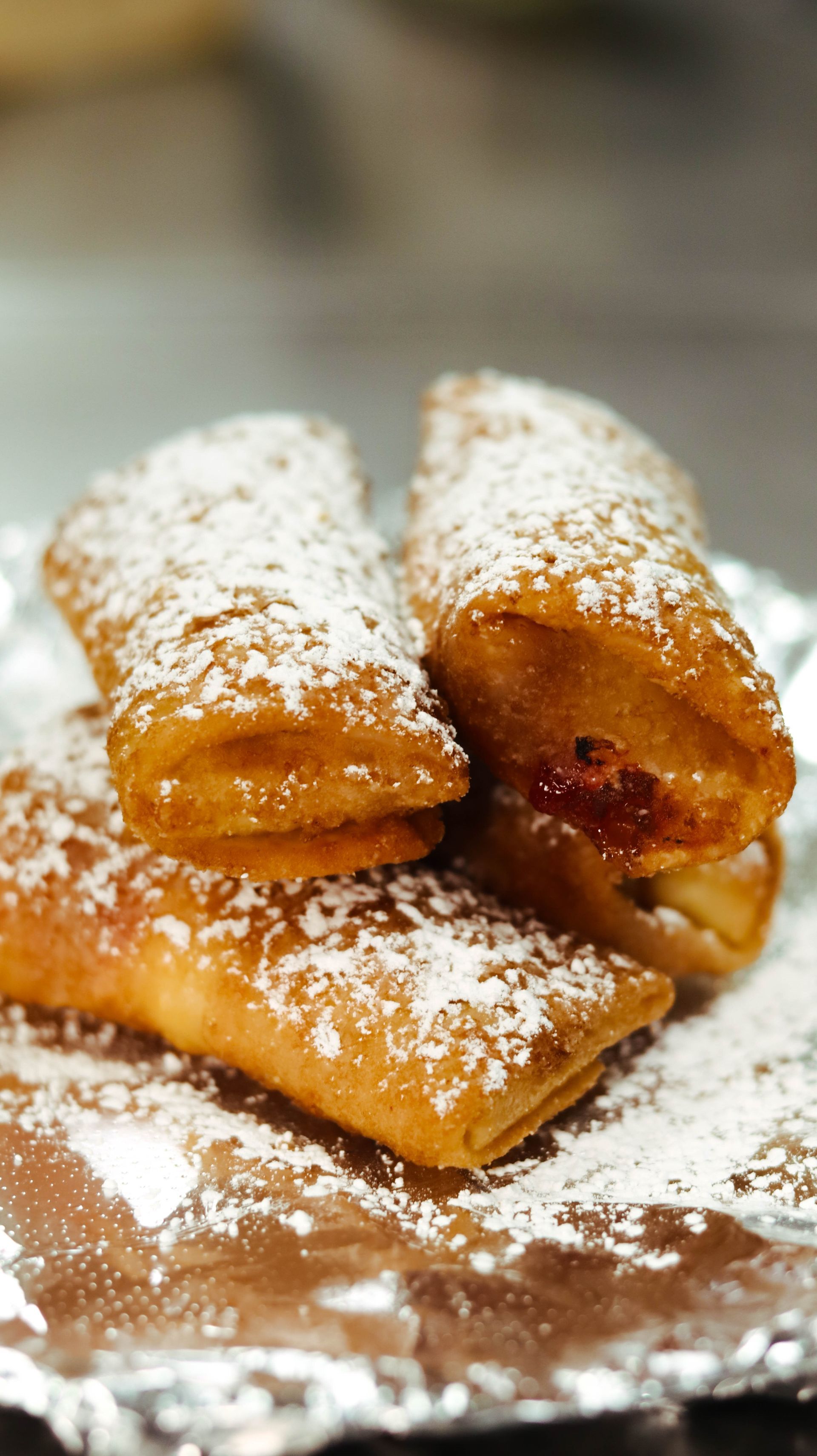 A close up of a plate of food with powdered sugar on it.