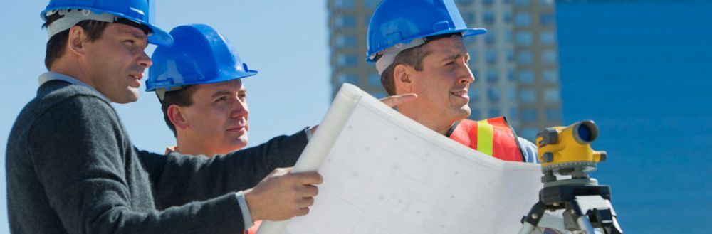 Contractors surveying a development project