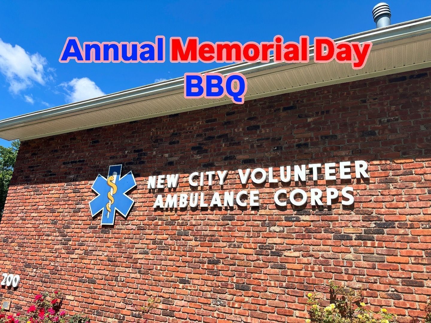 Annual Memorial Day BBQ at New City Volunteer Ambulance Corps building, blue sky backdrop.