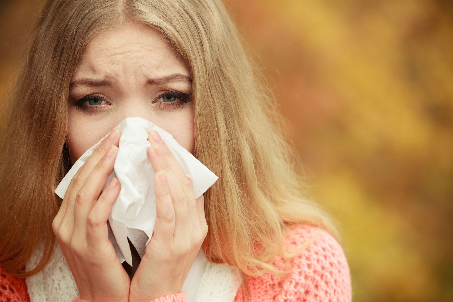 woman sneezing