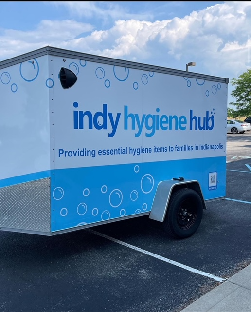 An indy hygiene hub trailer is parked in a parking lot