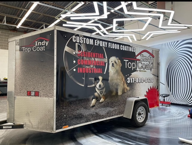 A trailer that says indy top coat on it