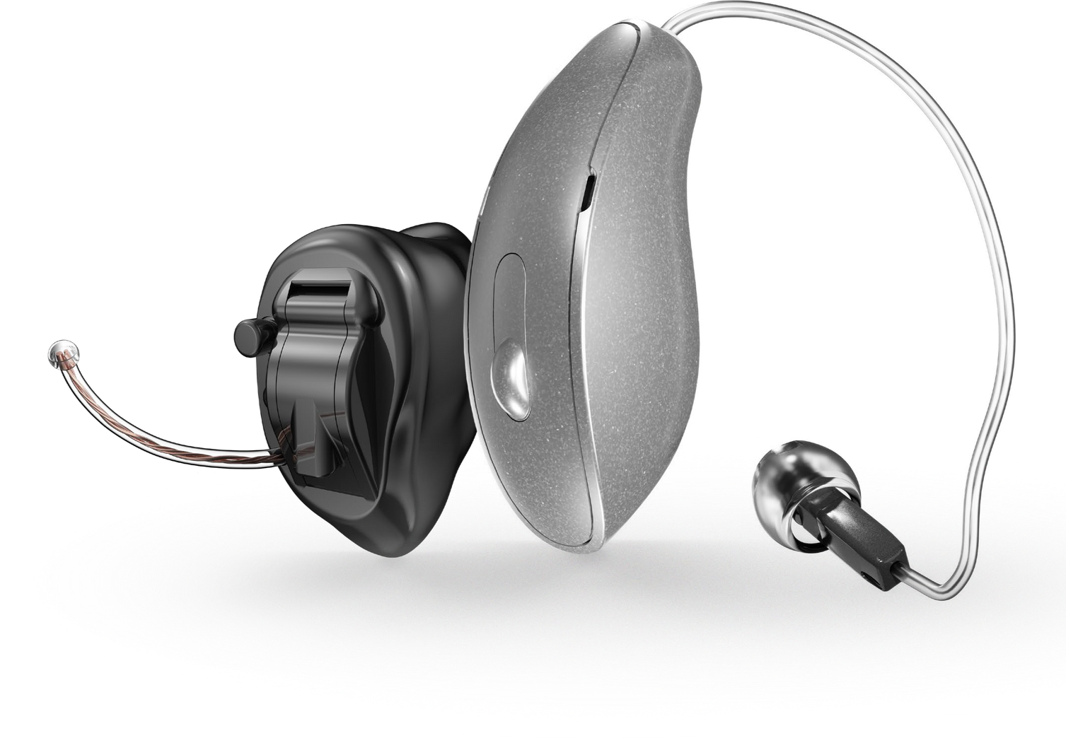 A group of hearing aids are sitting next to each other on a white background.