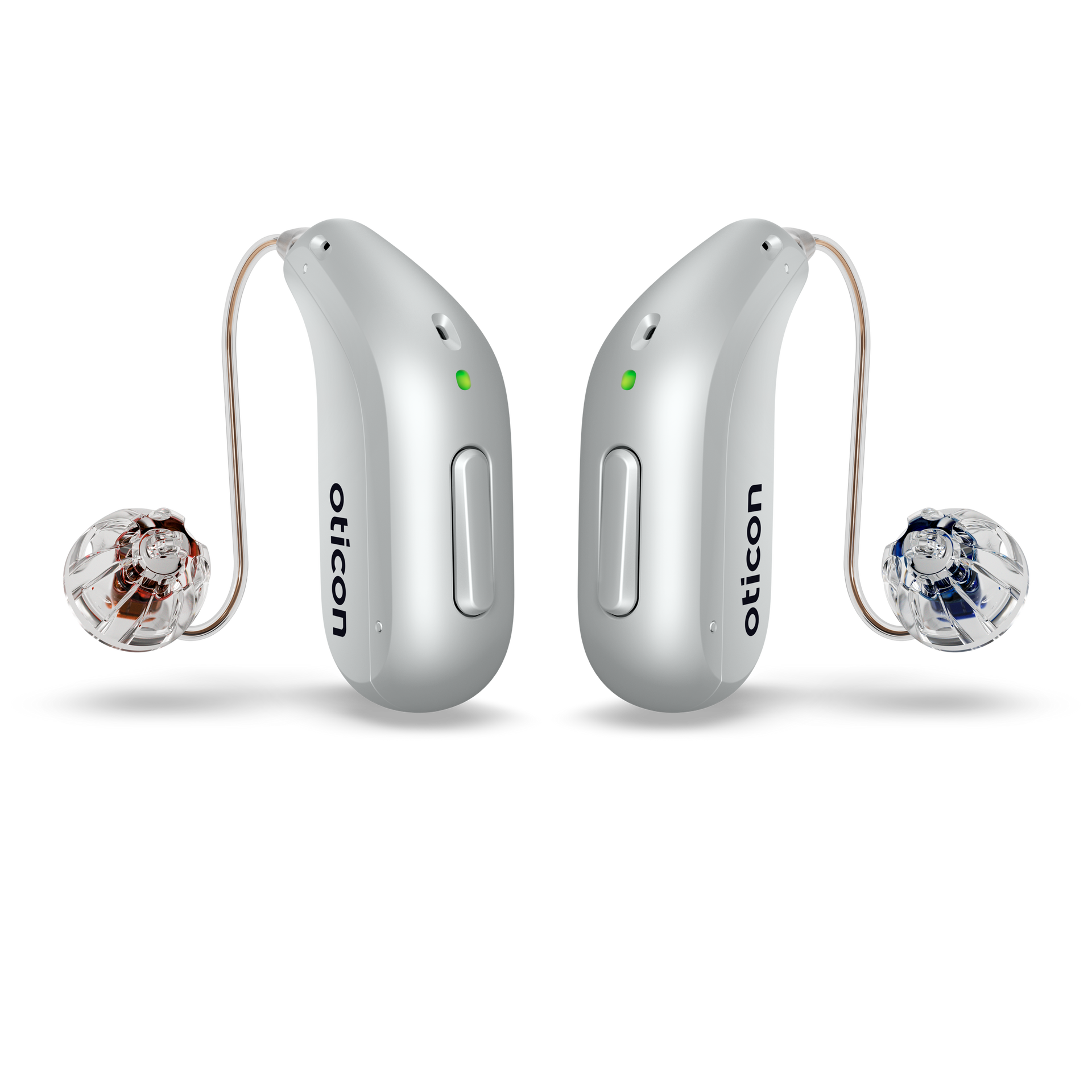 An oticon hearing aid is sitting on a white surface.