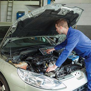 Mechanic repairing car