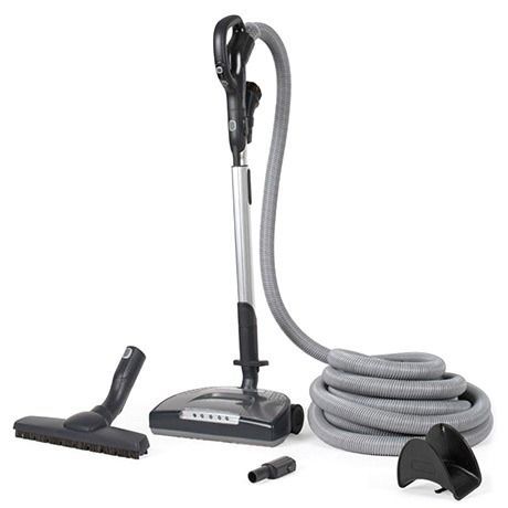 Upright vacuum cleaner with attachments, gray hose, and coiled power cord on white.