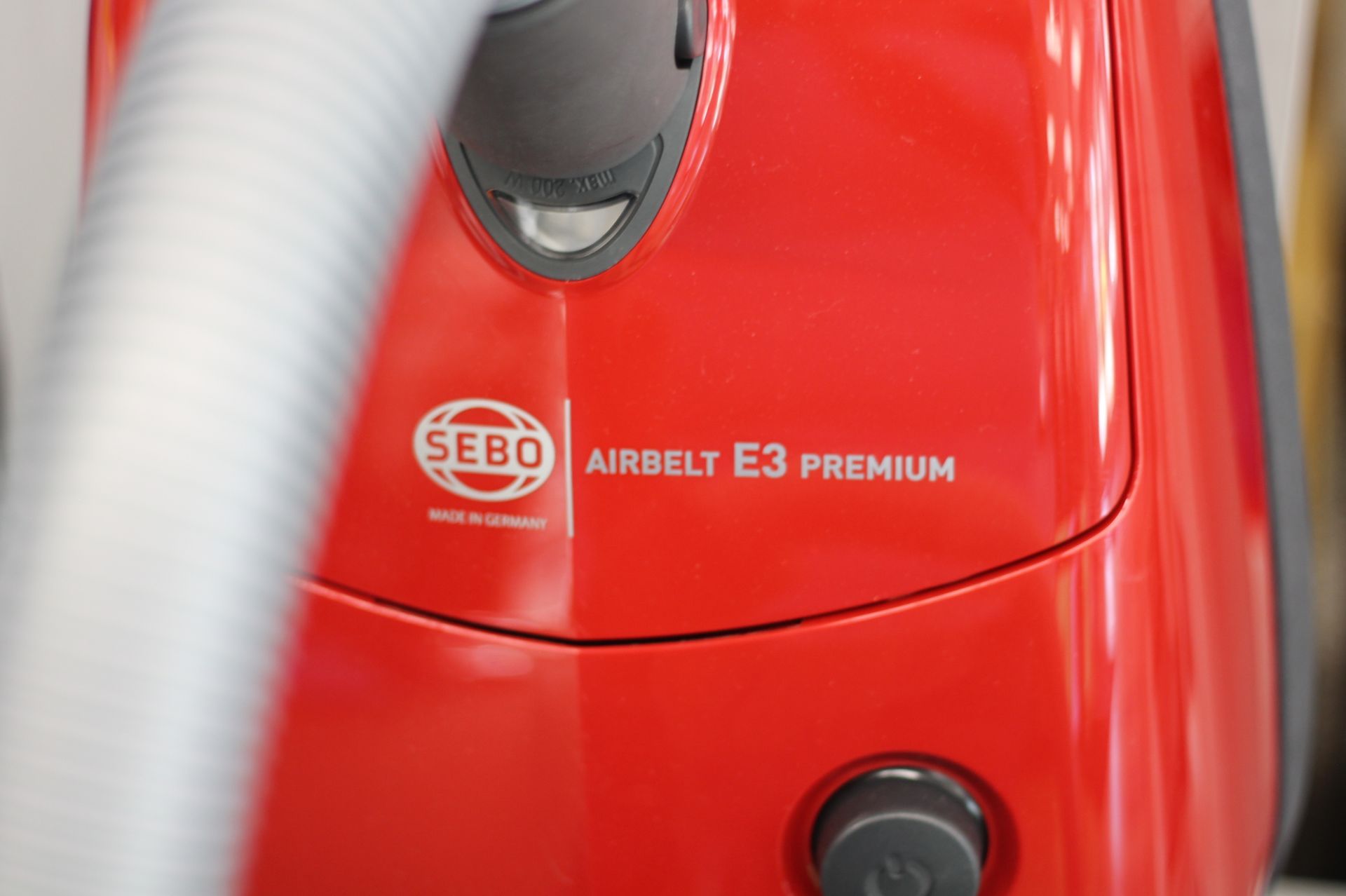 Red Sebo Airbelt E3 Premium vacuum cleaner.