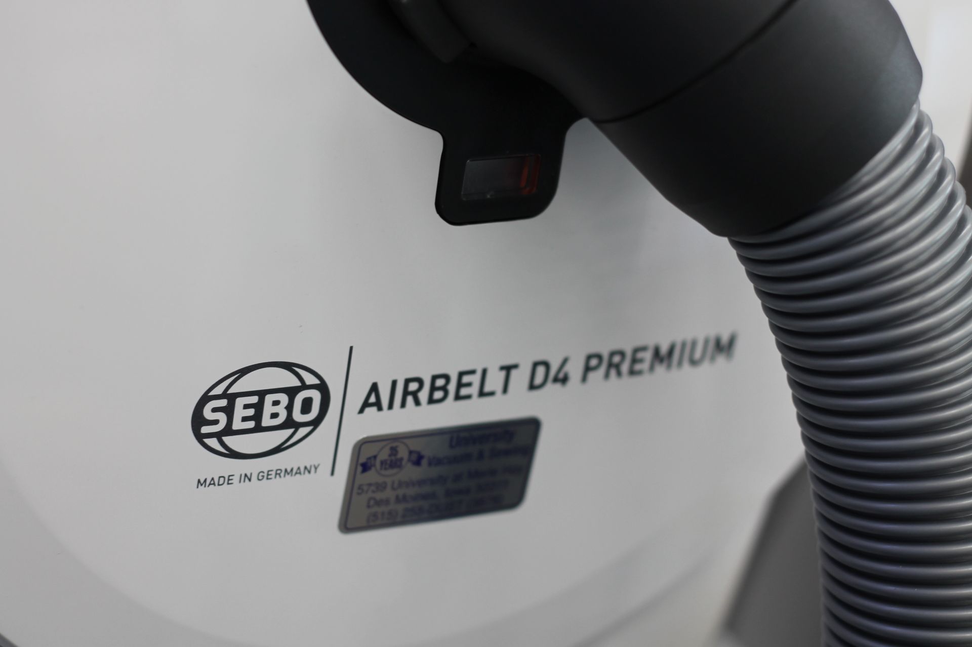 White SEBO Airbelt D4 Premium vacuum cleaner.