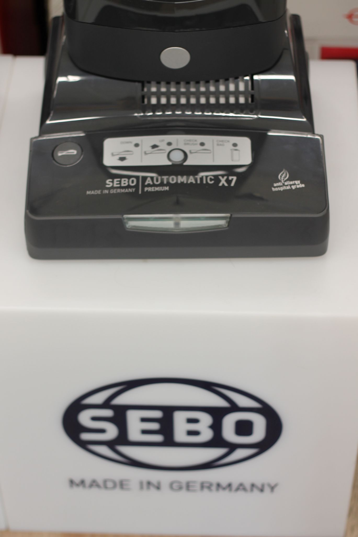 SEBO vacuum cleaner on a white surface with the brand logo 