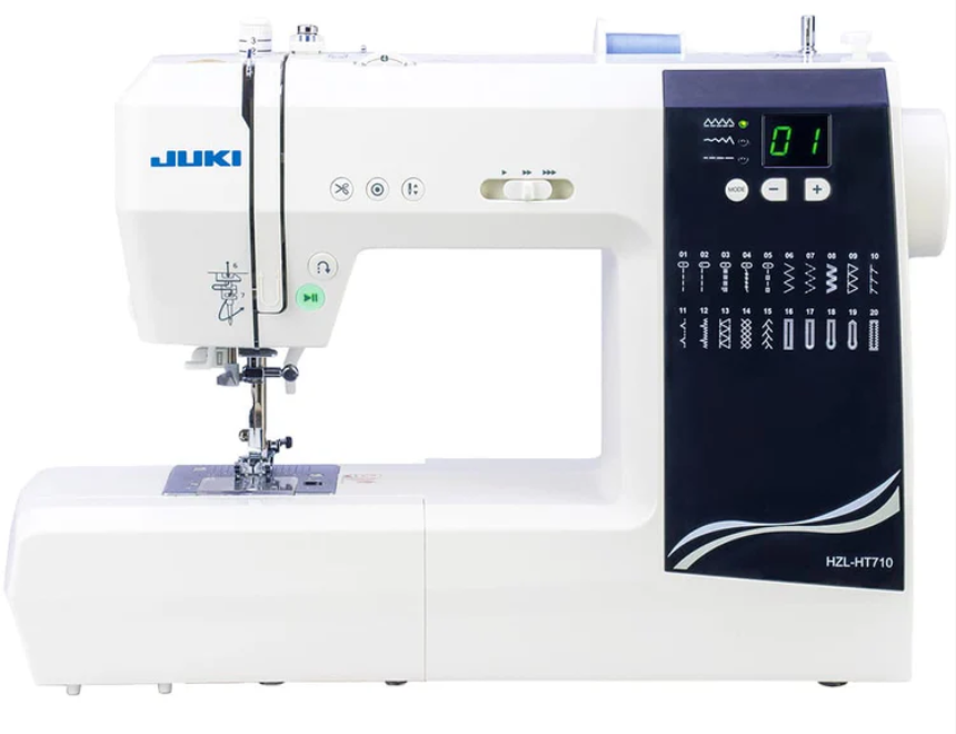 White and black Juki sewing machine with digital display and stitch options.