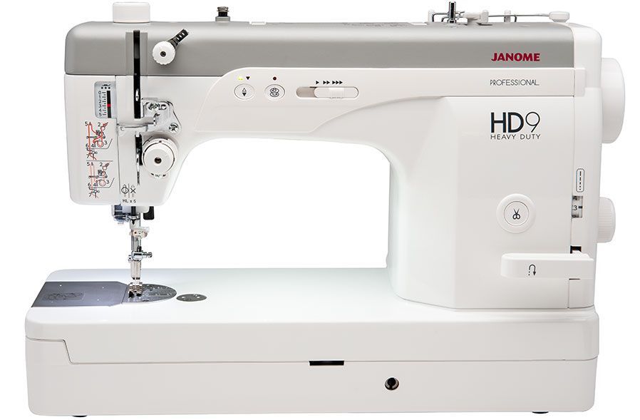 Janome HD9 Professional sewing machine, white and gray with visible controls and a work light.
