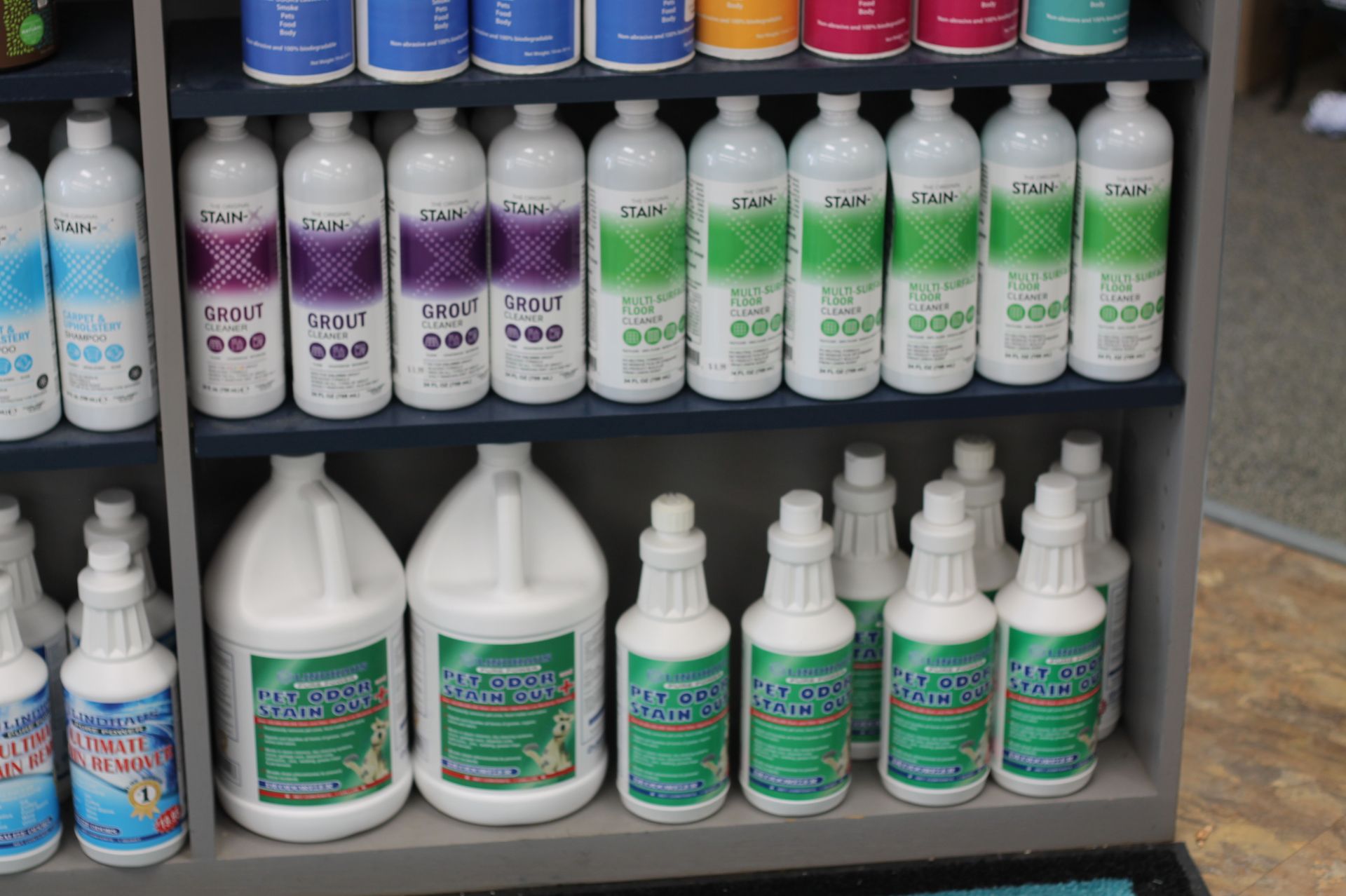Shelves stocked with various bottles of pool and spa chemicals.