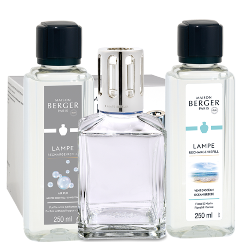 Maison Berger Paris lamp and two 250ml refill bottles. Clear glass with dark caps, and blue and white labels.