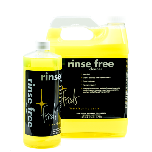 Two yellow Fred's Rinse Free Cleaner bottles; one tall and one gallon container. Black labels, white text.