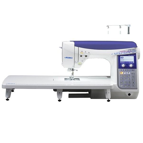 Juki sewing machine, white and blue, with an extension table, digital display, and thread spool holders.