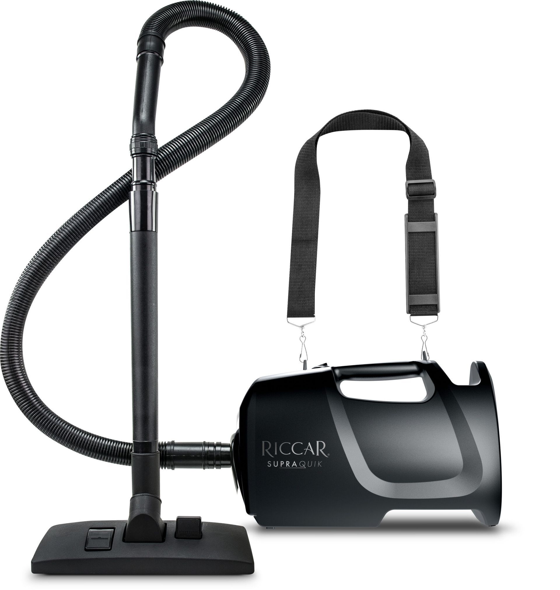 Black Riccar SupraLite canister vacuum with attached hose, wand, and shoulder strap.