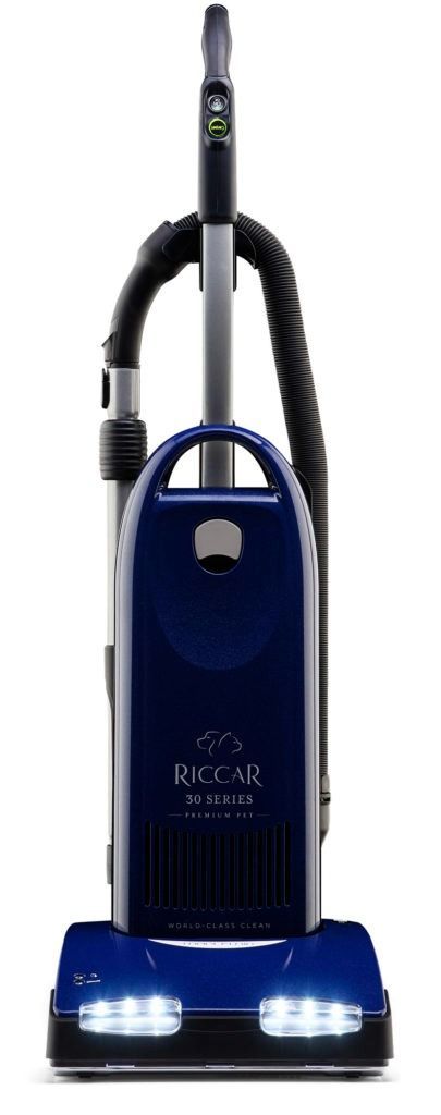 Black and red upright vacuum cleaner on a white background.