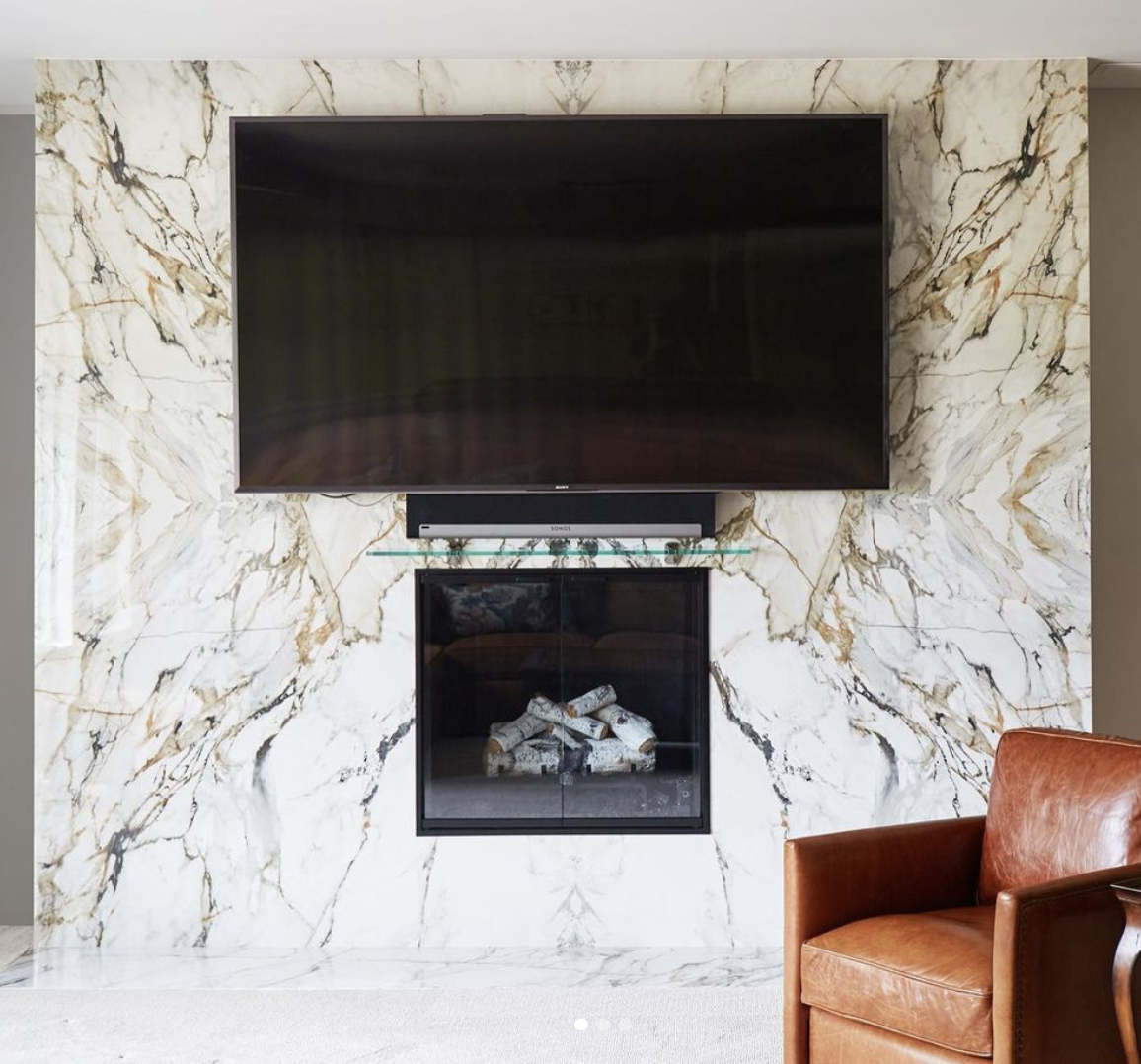 Fireplace area with a marble design