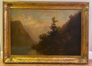 Oil painting of a mountain lake landscape, dark green trees, light clouds, and an ornate gold frame.