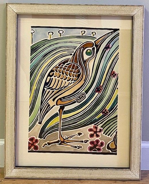 Framed artwork: stylized heron in a wetland setting, depicted with curved lines and earth tones.