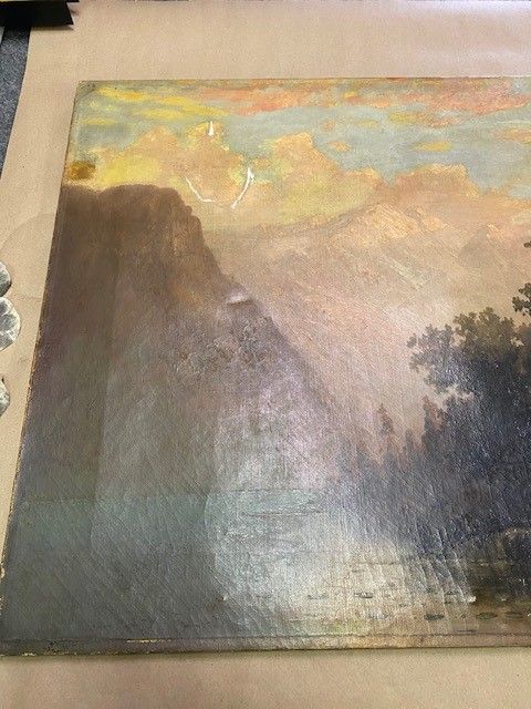 Landscape painting, possibly a waterfall scene. The paint has damage and scratches.