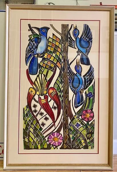 Watercolor painting: Blue birds on a tree with colorful leaves and flowers, framed in a neutral mat and wood frame.