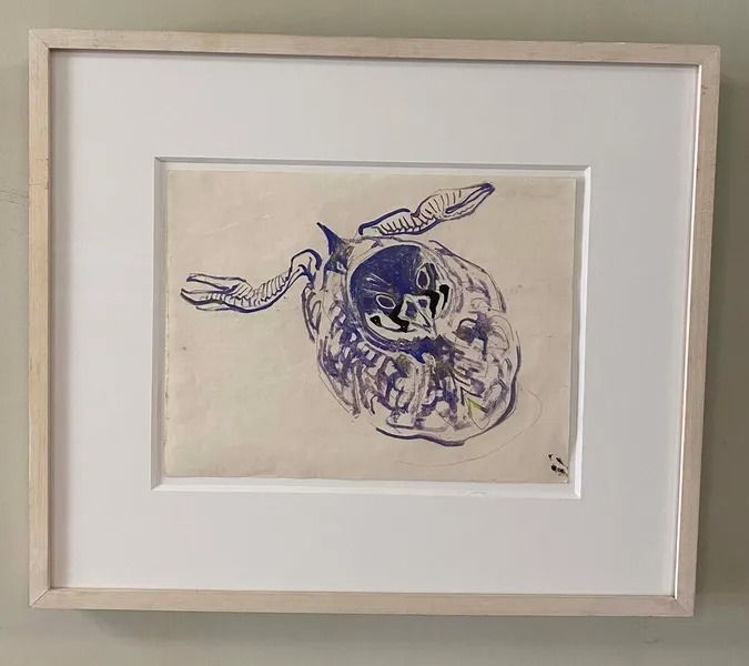 Framed drawing of a blue and white amorphous shape with figures. A light-colored mat and wooden frame surround the artwork.