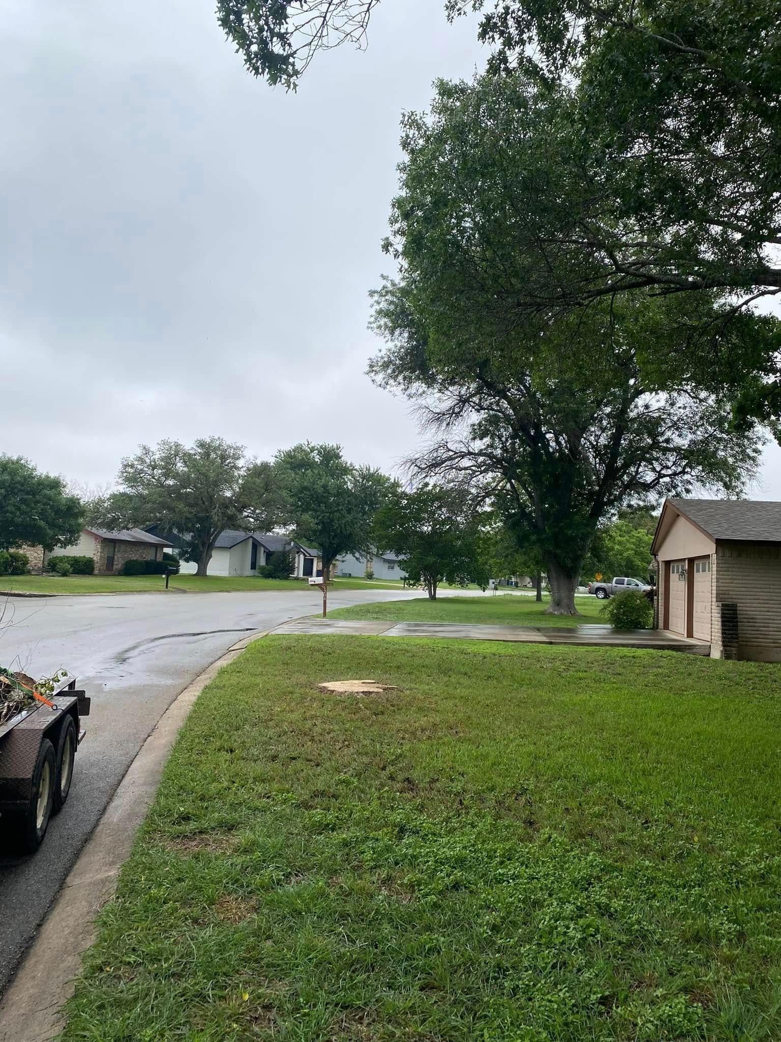 A truck is parked on the side of the road in a residential neighborhood.