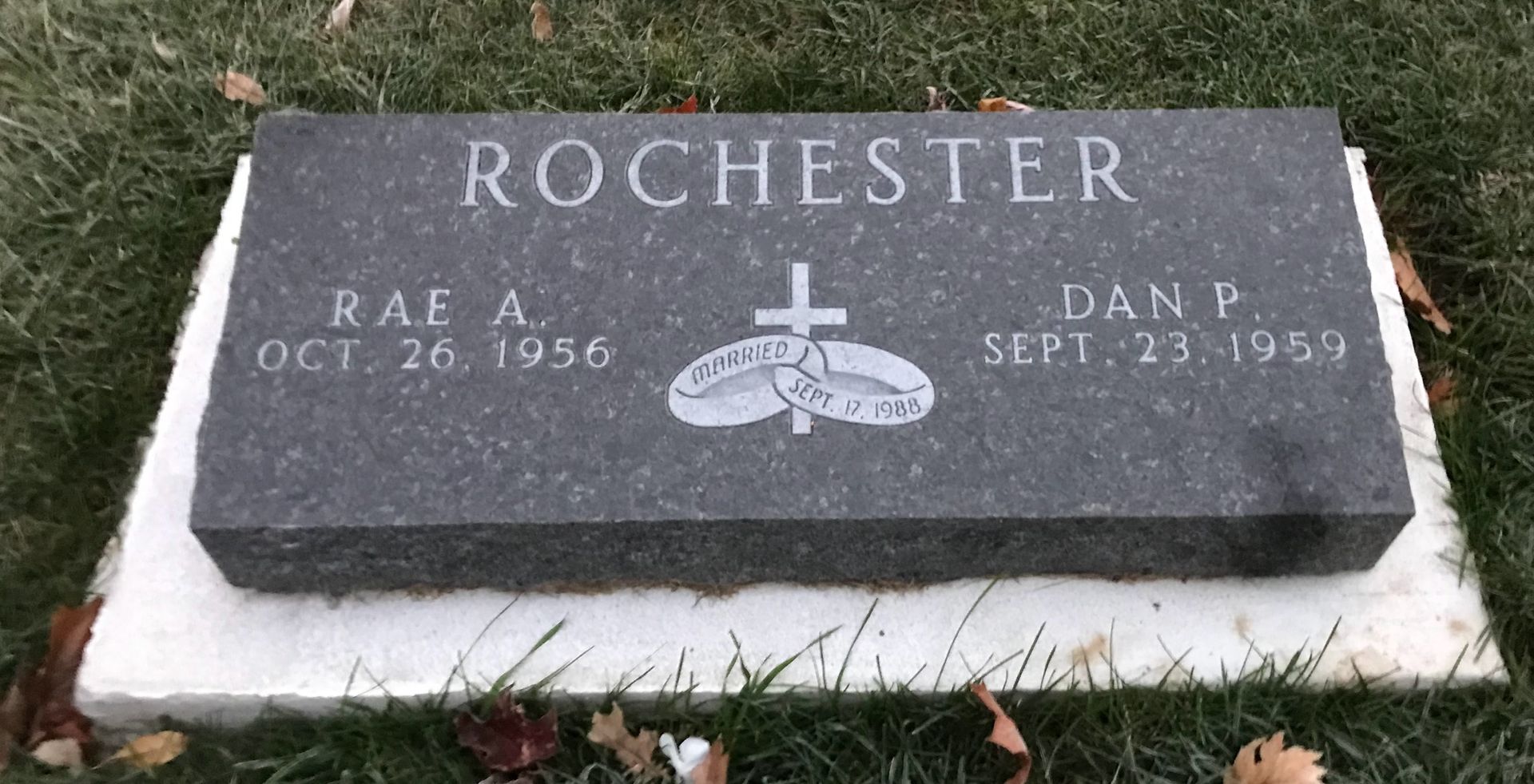 A gravestone in a cemetery with the name Rochester on it