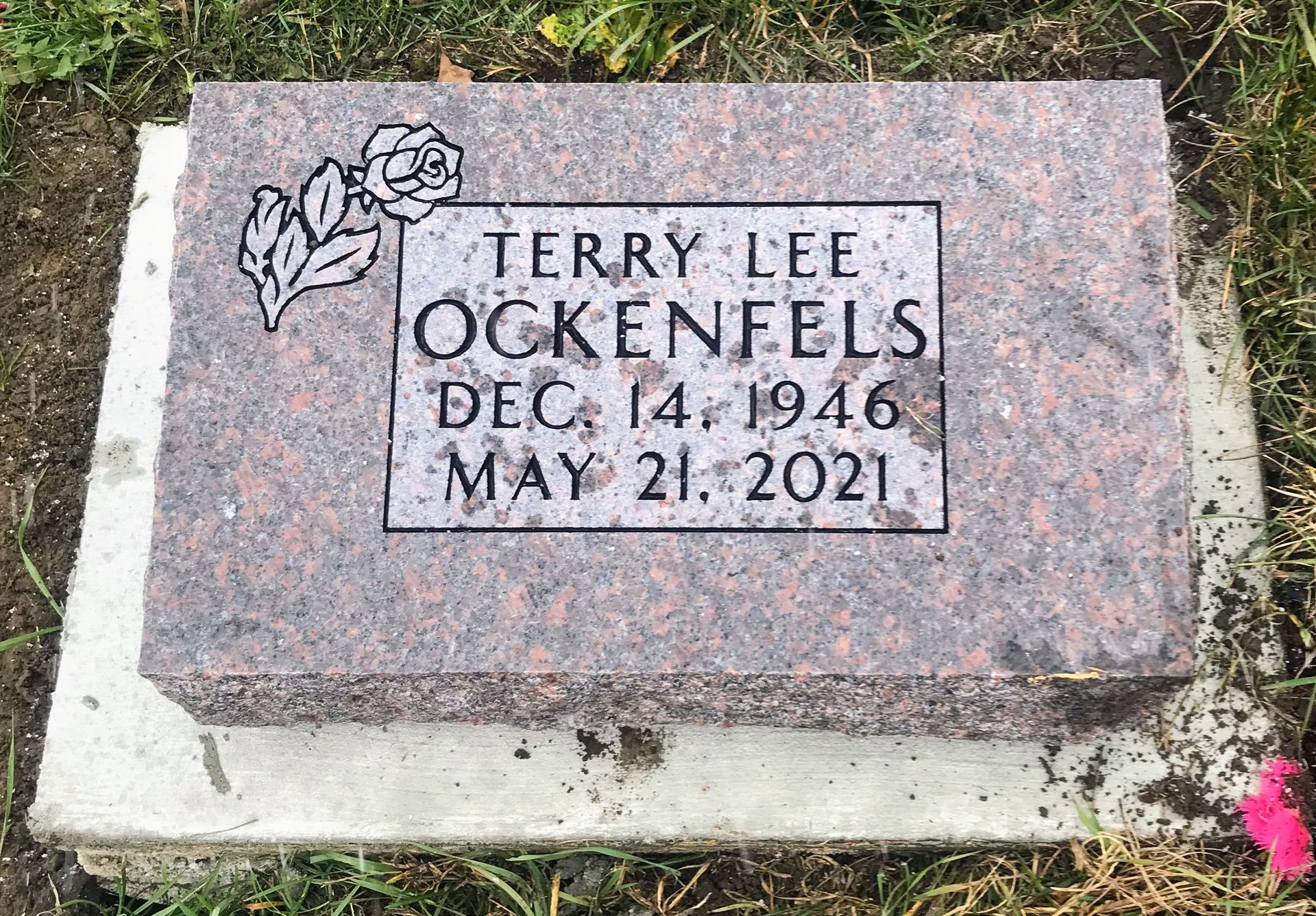 A gravestone for Terry Lee Ockenfels, who died on May 21, 2021