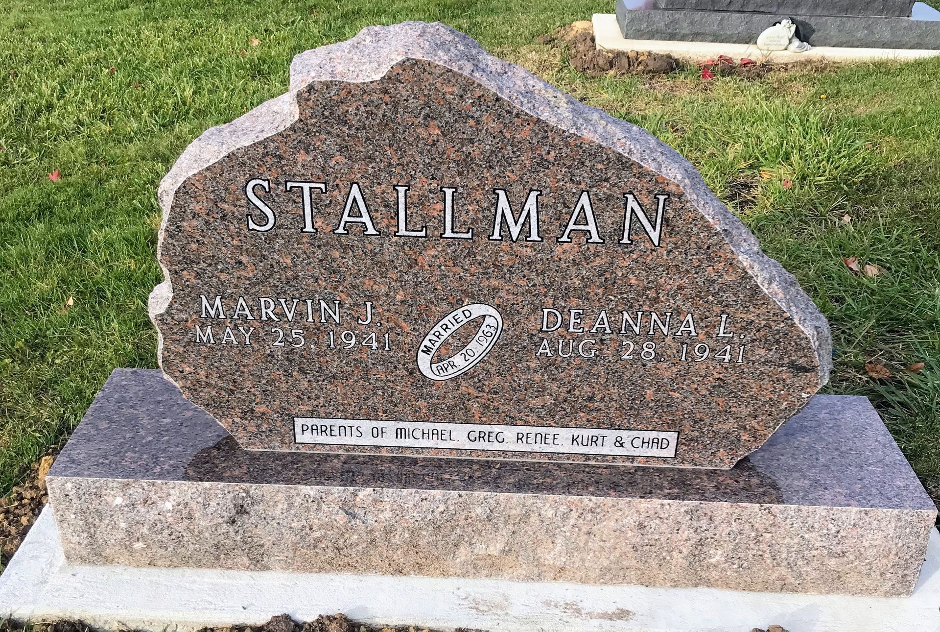 A gravestone for a man named Stallman in a cemetery