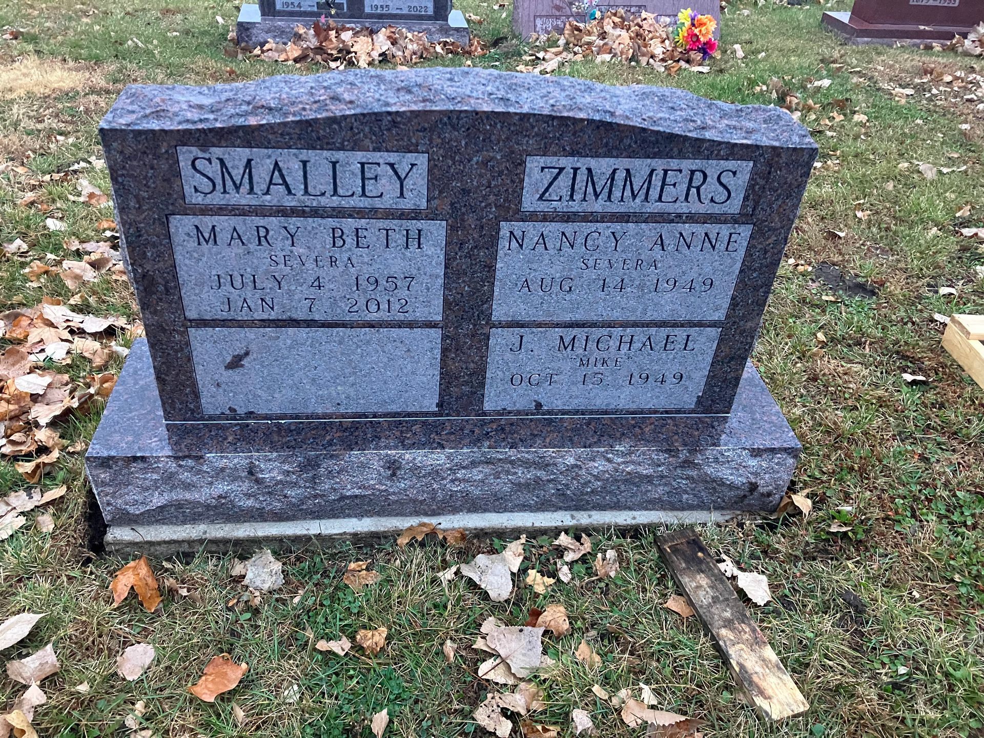 A gravestone for Smalley and Zimmers in a cemetery