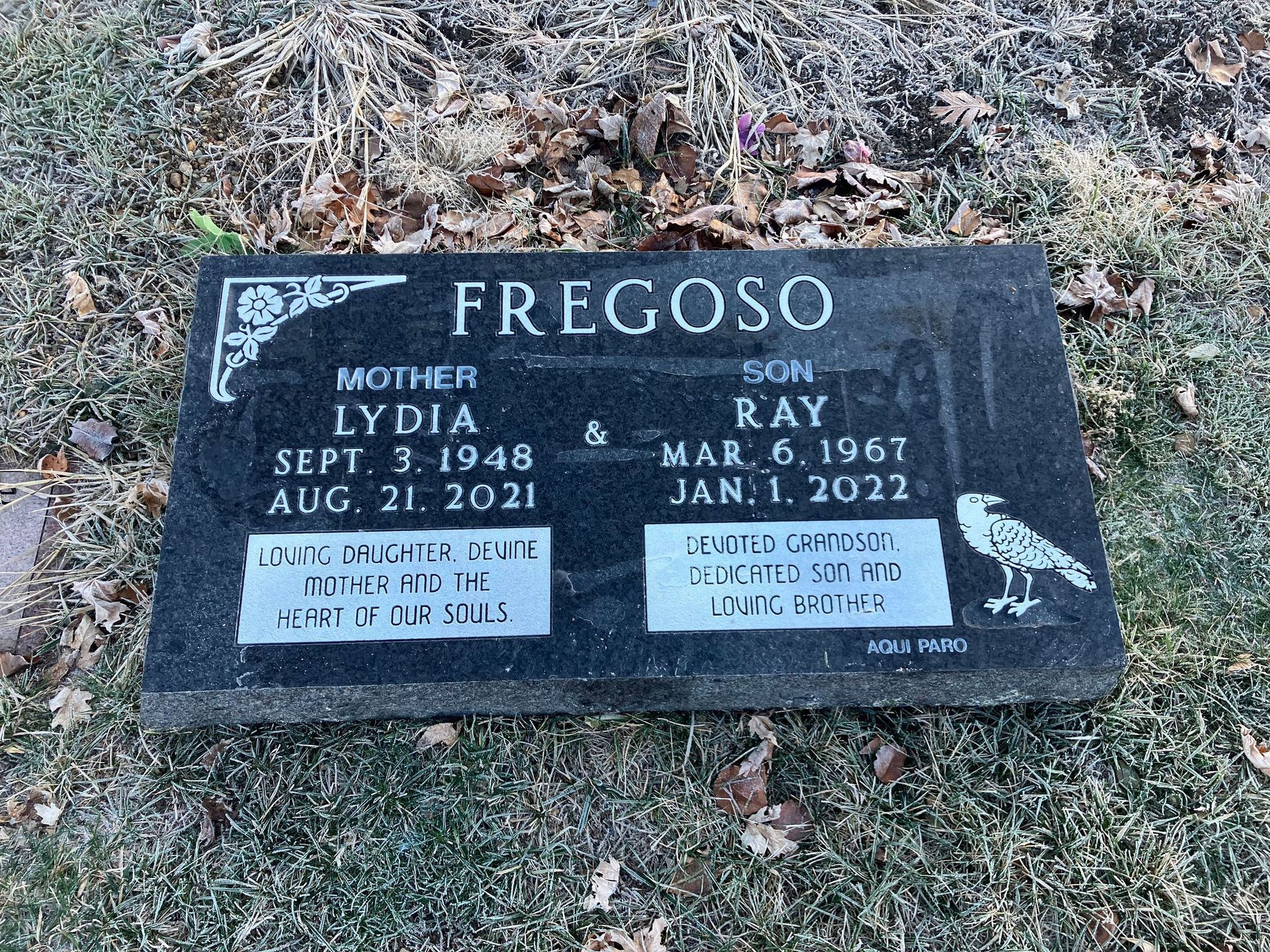 A black gravestone with the name Fregoso on it