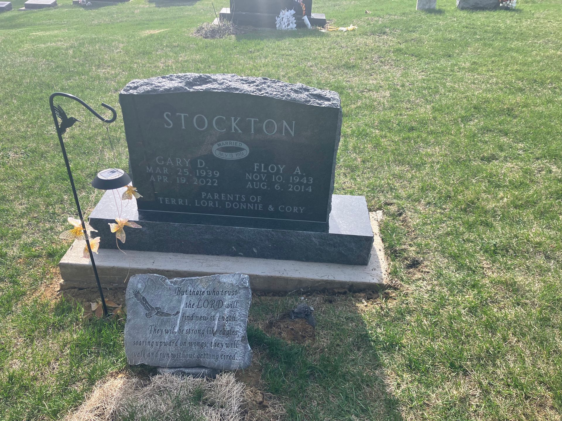 A gravestone in a cemetery with a kiss on it