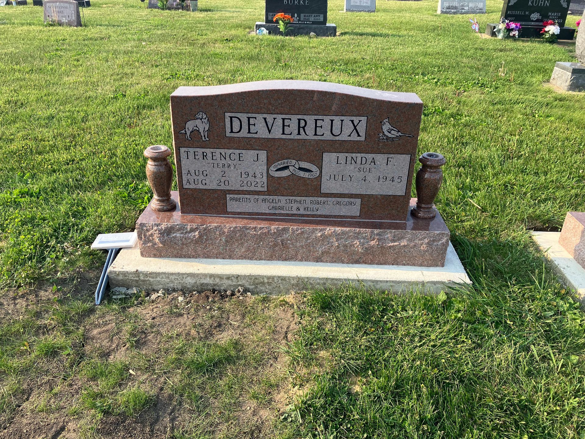 A gravestone in a cemetery with the name Devereux on it