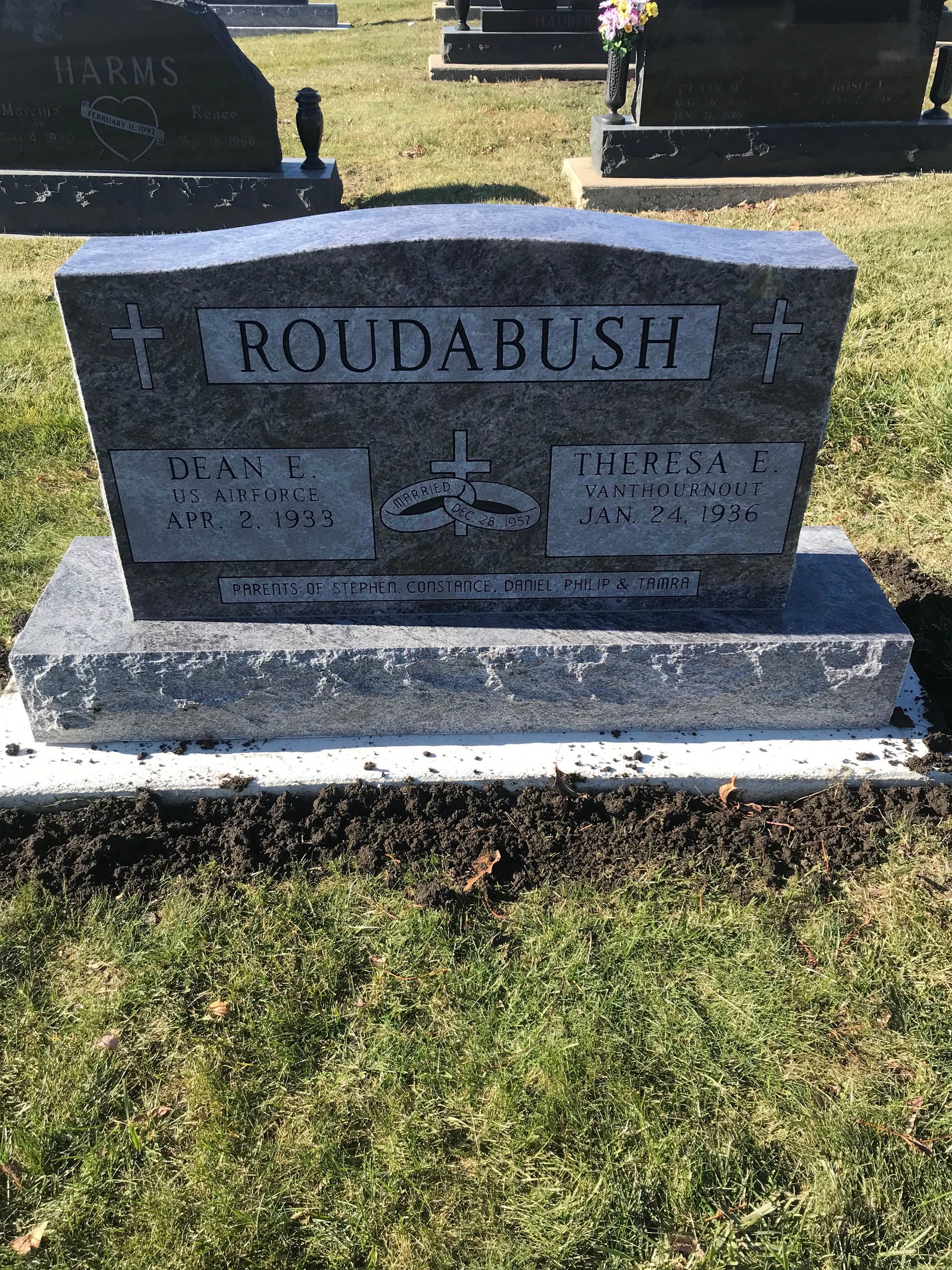 A gravestone in a cemetery with the name Roudabush on it