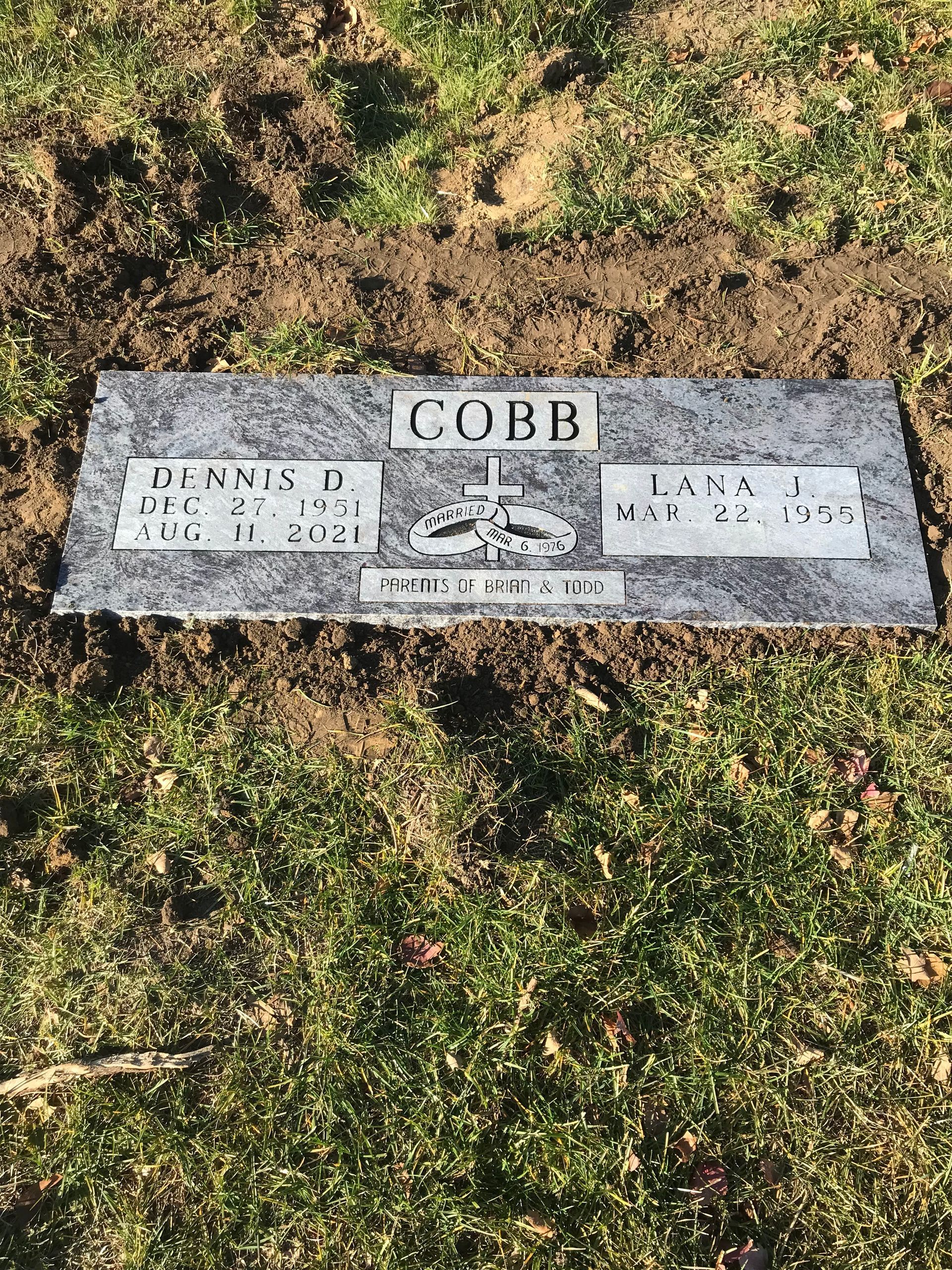 A gravestone in a cemetery with the name Cobb on it