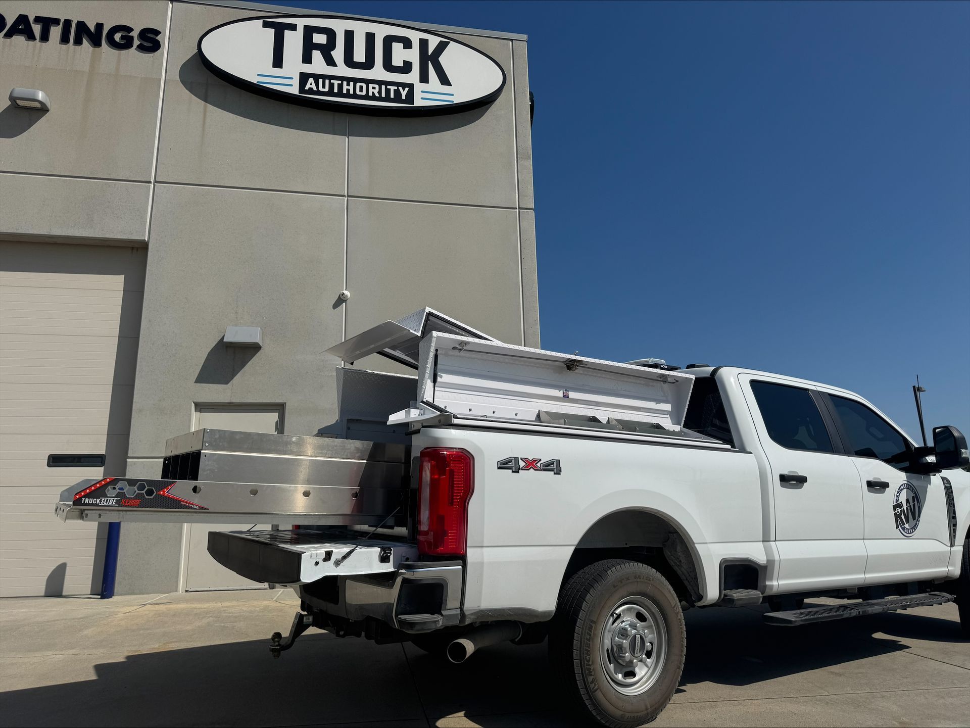 White pickup truck with utility bed.