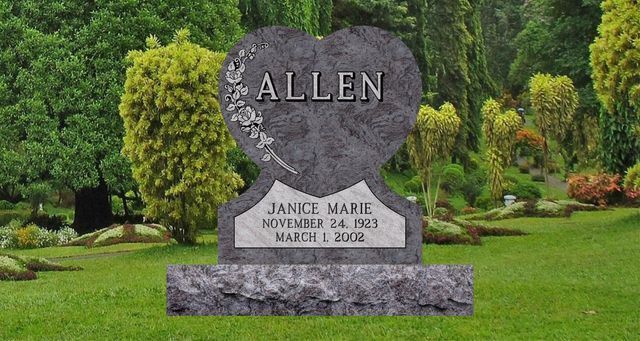 A Bahama Blue Granite carved heart single monument.