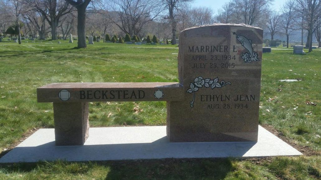 Granite bench and tombstone with Beckstead inscribed in a cemetery.