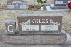 Tombstone of Giles family with names and dates in a cemetery - after