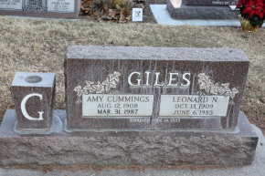 Tombstone of Giles family with names and dates in a cemetery - before