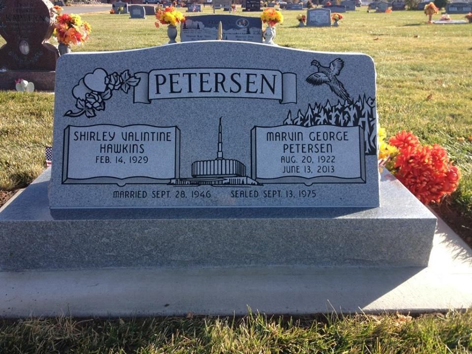 Headstone of Shirley Valentine Hawkins Petersen and Marvin George Petersen. In a cemetery.