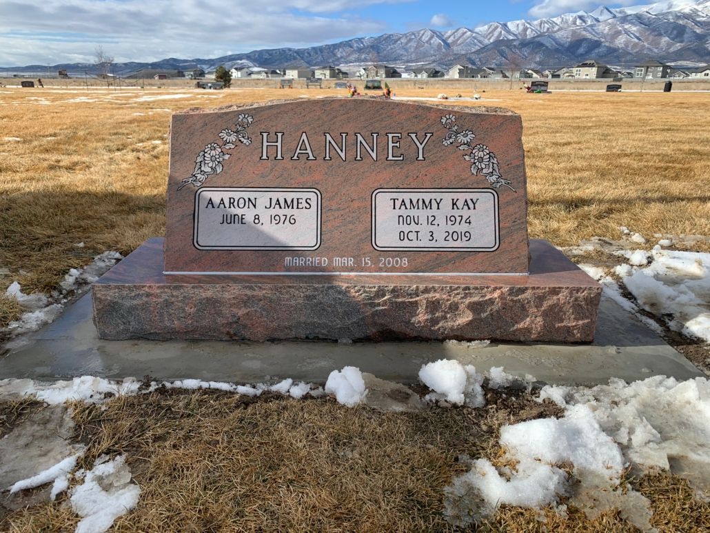Headstone in a cemetery with names