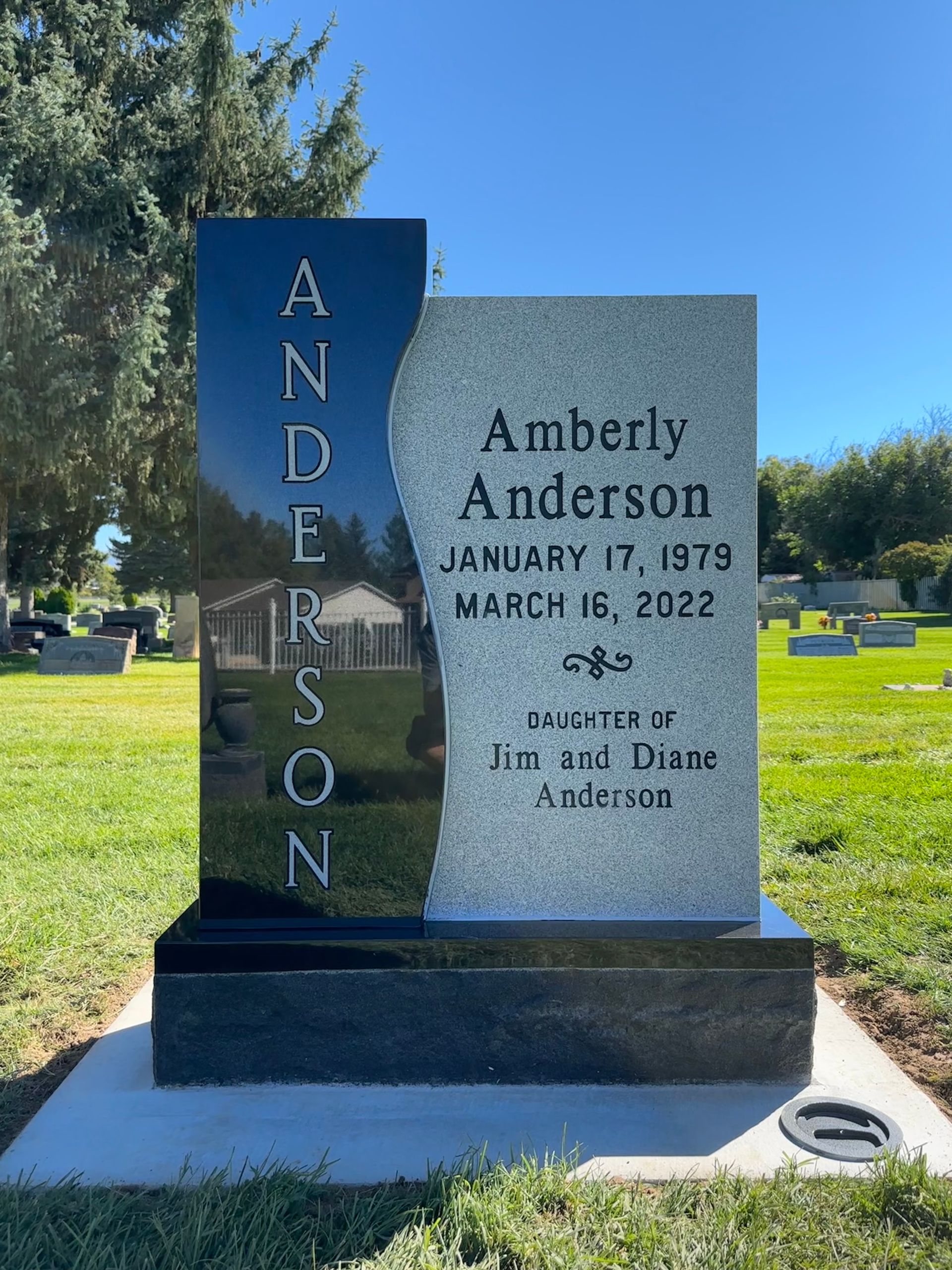 Gravestone of Amberly Anderson in a cemetery.