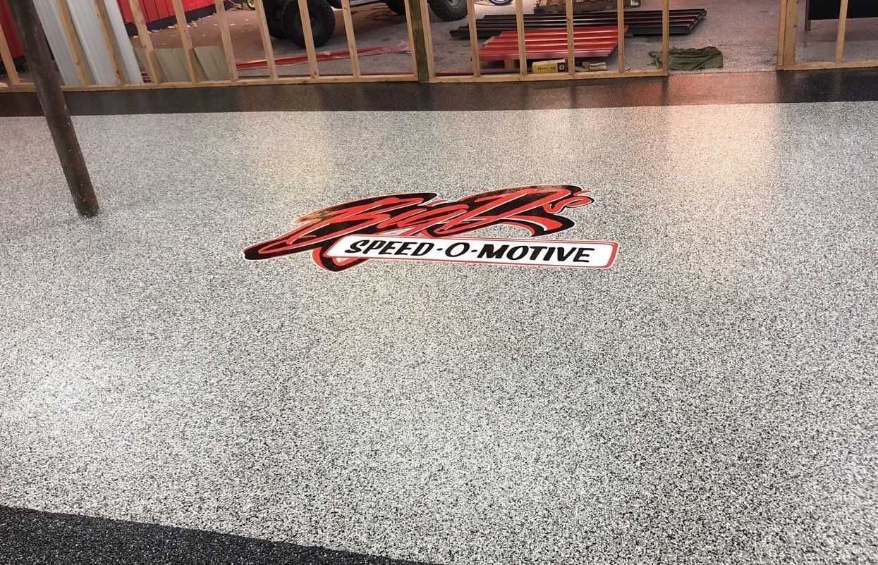 A speed o native logo is on the floor of a building